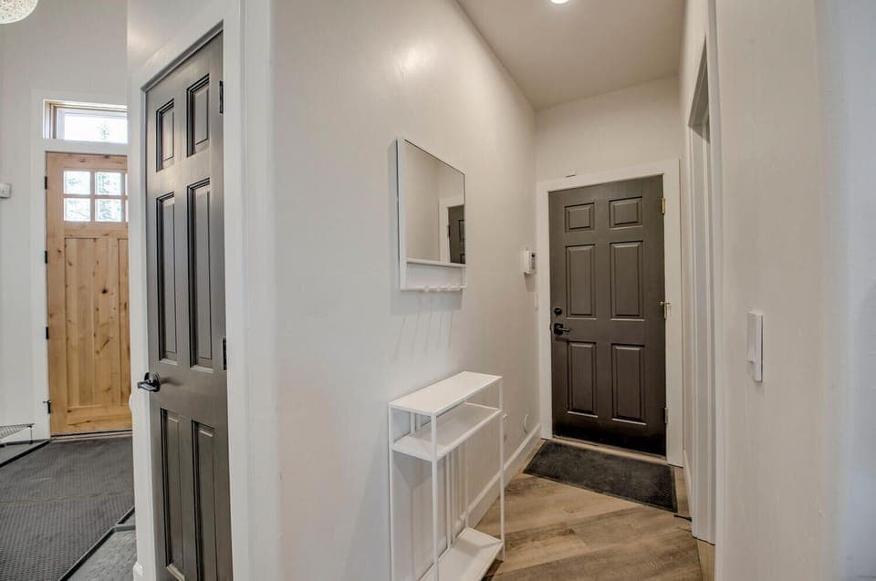 Hallway to garage - powder bath on right