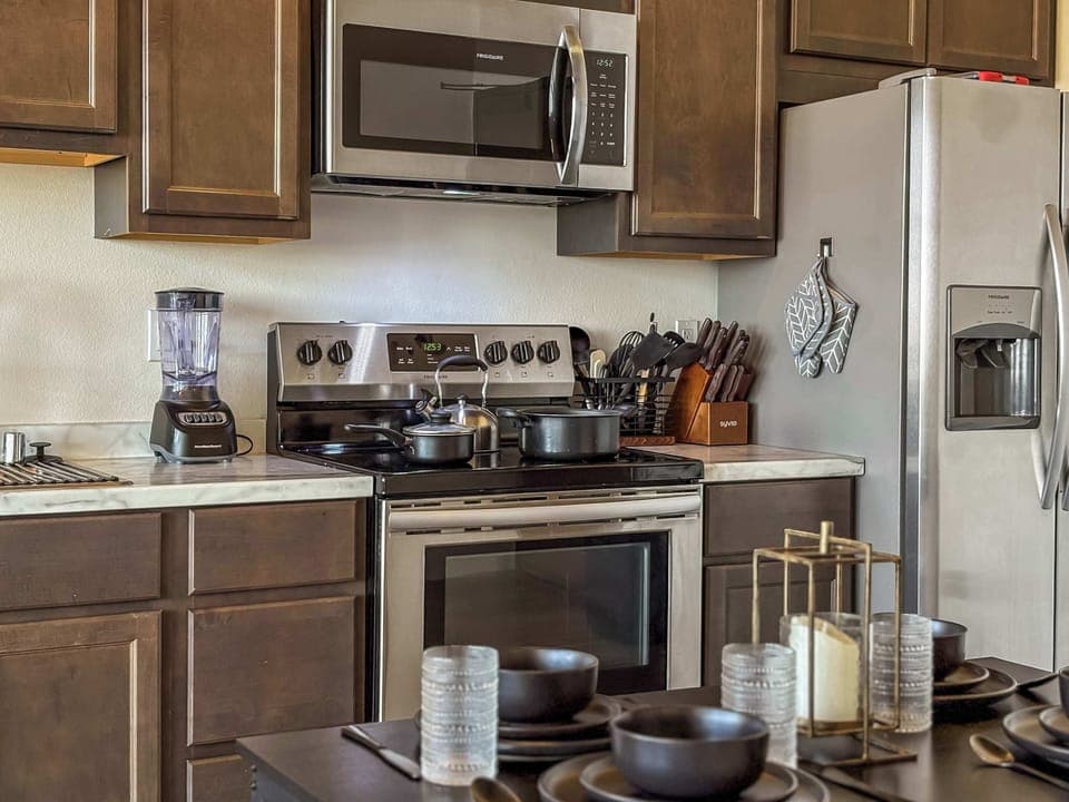 Our fully equipped kitchen is ideal for extended stays, featuring a stovetop, microwave, refrigerator with freezer, toaster, blender, and coffee machine.