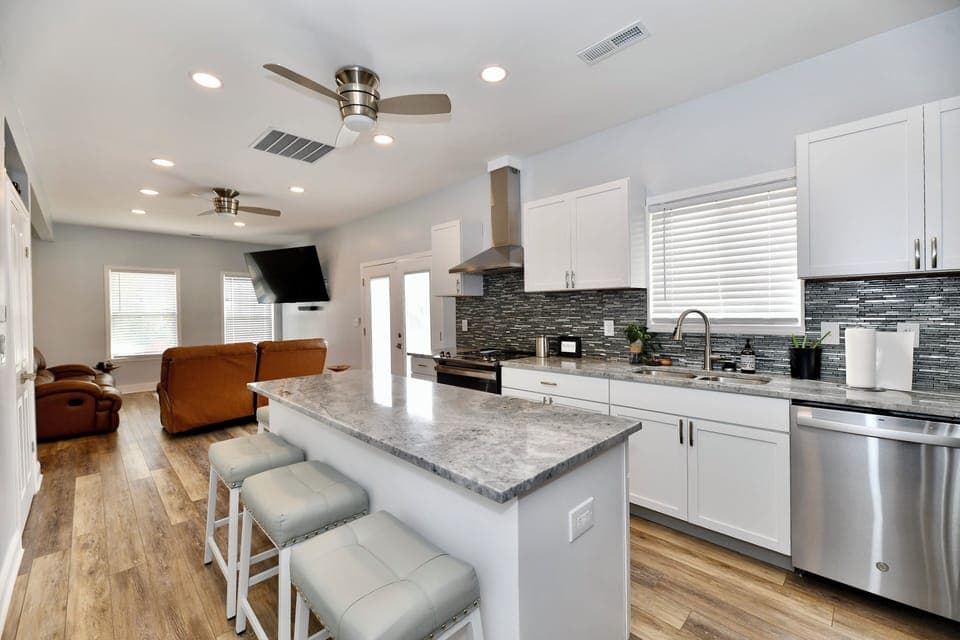 Full island in kitchen set to seat 4 comfortably.