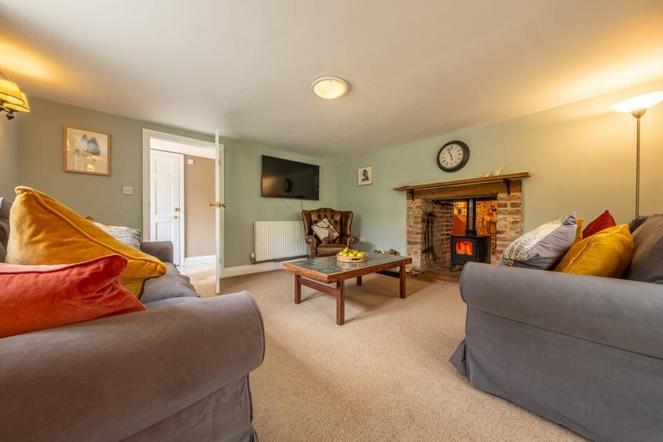 Hope Cottage, East Rudham: A very restful sitting room with wood burning stove