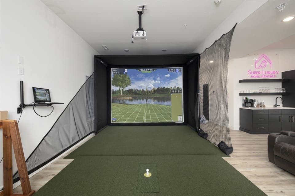 Basement Level: Family & Game Room w/ golf simulator, putting green, and pop-a-shot