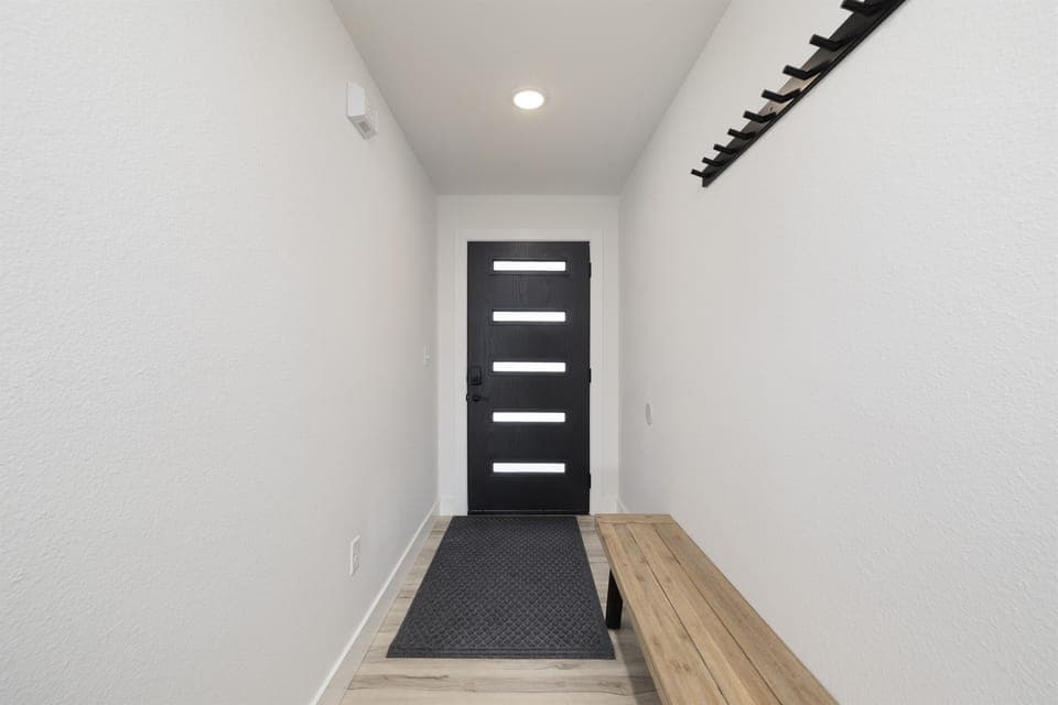 Main Level: Entrance with bench & coat rack