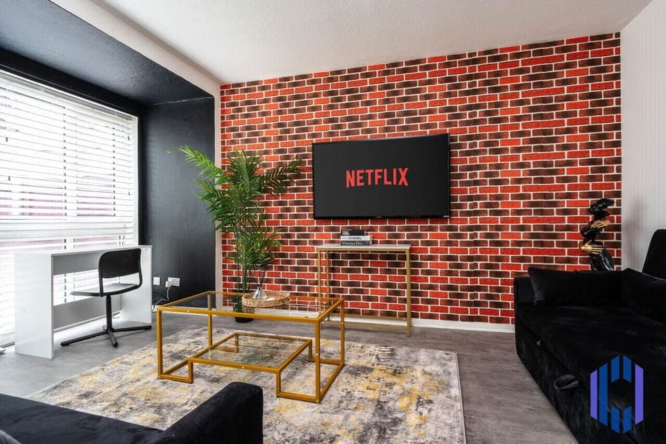 Living room  - 50`  Smart TV loaded with Netflix, HDMI cable, ambient lighting,  extra fast Wi-Fi & a Foosball table - Complimentary tea & coffee available for your enjoyment