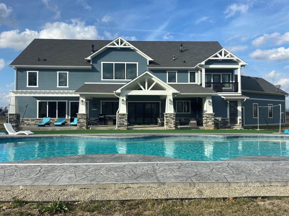 Pool and hot tub are equipped with lights and electric safety cover.