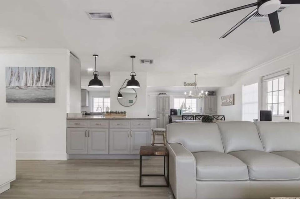 Relax in your open-concept living space where modern comfort meets coastal charm, complete with a fully-equipped kitchen for your culinary adventures.