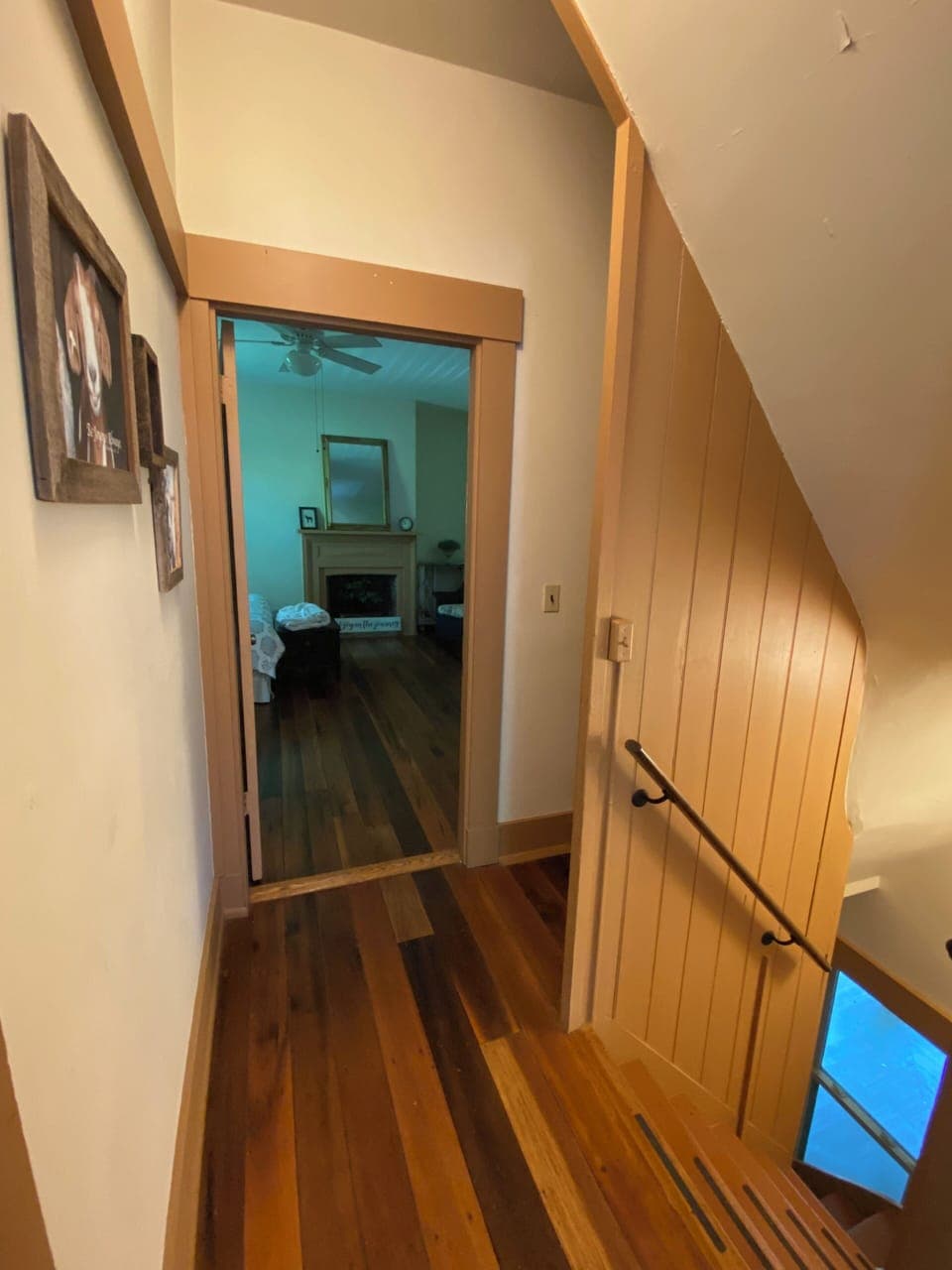 Hallway to Primary Bedroom + Butler Stairs down to Kitchen