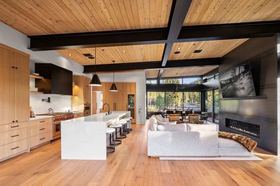 Main Living Space: Living room and kitchen, open layout, soaring windows, sliding glass doors to outdoor living space