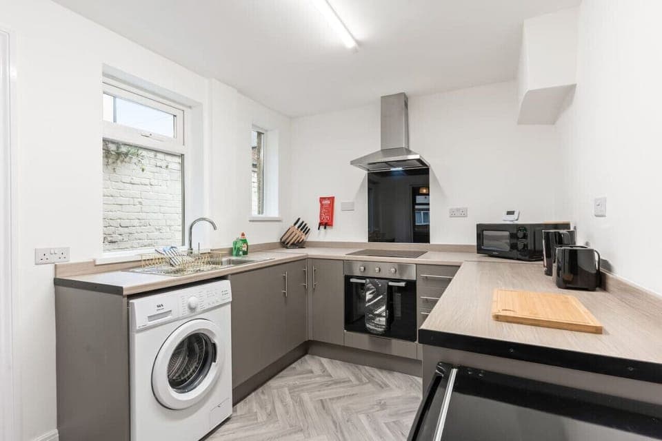 A fully equipped kitchen with everything you need to prepare a home cooked meal.