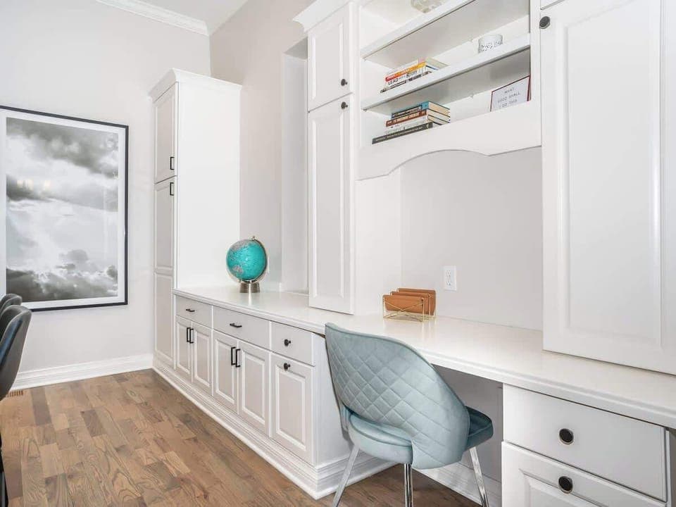 The workspace features a built-in desk area designed for efficiency and comfort. It includes ample desk space, a comfortable chair, and is ideal for focused work or study sessions, ensuring a productive environment.