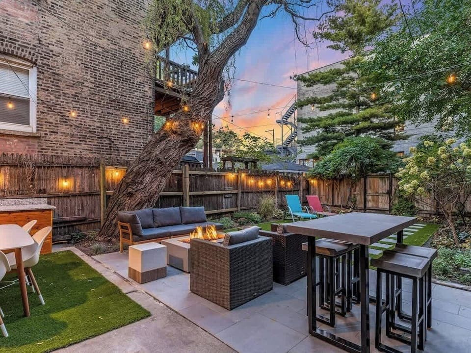 The private backyard in Chicago offers ample space, perfect for relaxation and outdoor activities amidst a serene urban setting.