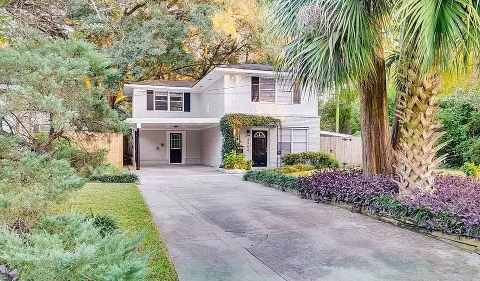 Beautifully landscaped. Front entry w/ covered carport.