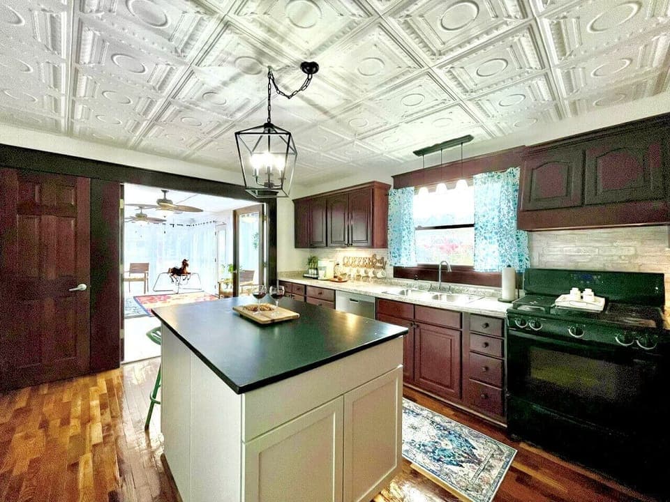 Step into a kitchen that blends vintage charm with modern convenience. Whether you`re an aspiring chef or just love the ambiance, this space invites you to create culinary delights.