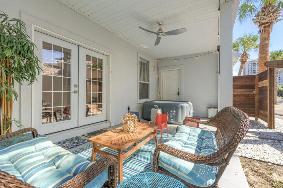 A perfect outdoor space with comfortable seating, a relaxing hot tub, and an outdoor shower, offering a luxurious and refreshing retreat!