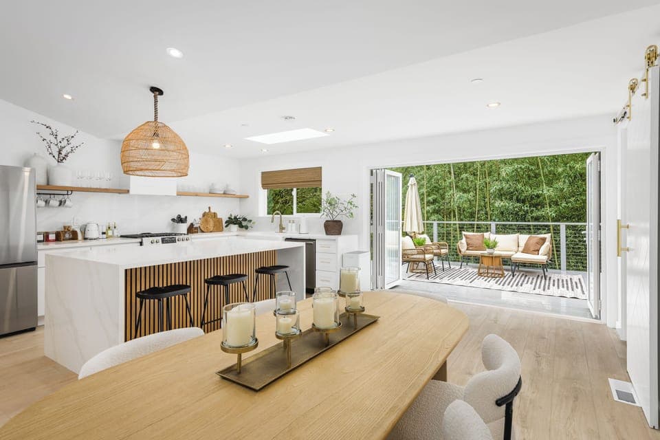 Savor a meal and the fresh air coming through the bifold patio door.