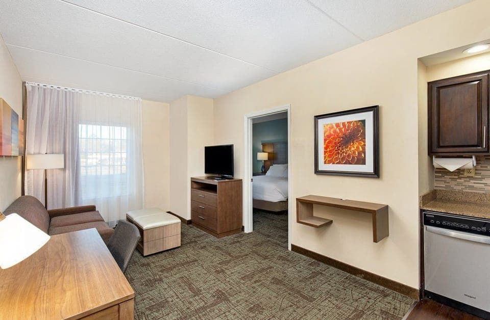 Delight in modern amenities with inviting seating and a vibrant view, making this suite an oasis of relaxation and convenience.