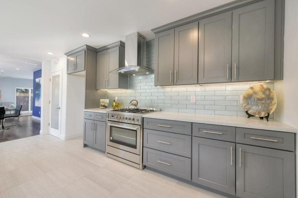 Extra large sized kitchen with cookware, pots, plates and cooking material