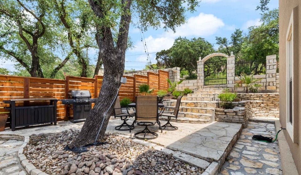 Beautiful shared courtyard with dining, grill, dining, and prep table!