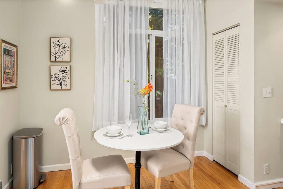 Indulge in intimate meals in our quaint dining corner, surrounded by light and modern comforts.