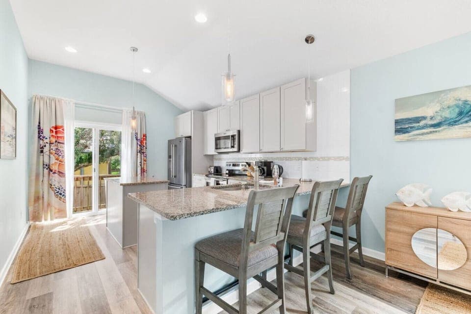 Cozy breakfast nook with comfortable seating for 3, perfect for enjoying morning meals in a relaxed setting.