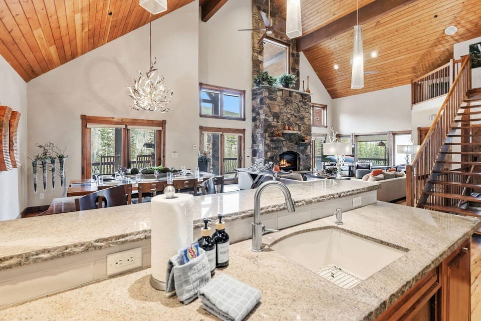 The gorgeous main living space boasts a living room, kitchen, and dining room all seamlessly blended together.