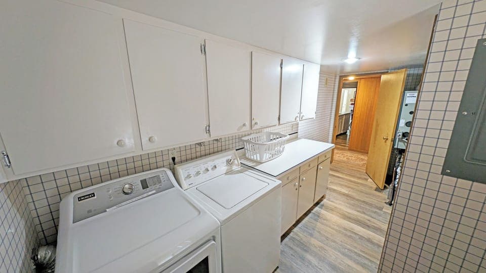 To the left of the entry is the Laundry room which also leads outside.