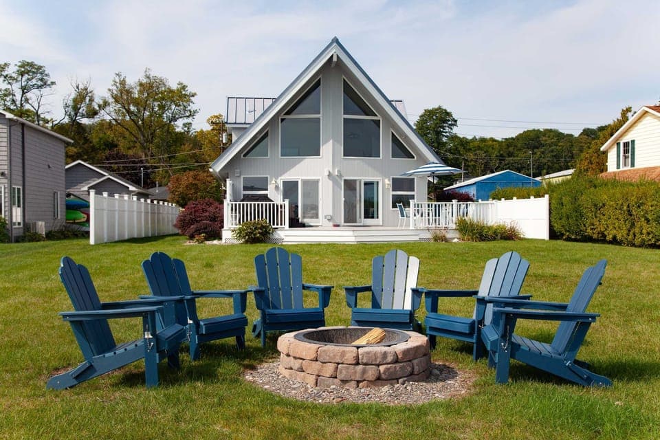 Spacious lawn, fire pit, and lakefront views—perfect for unwinding.
