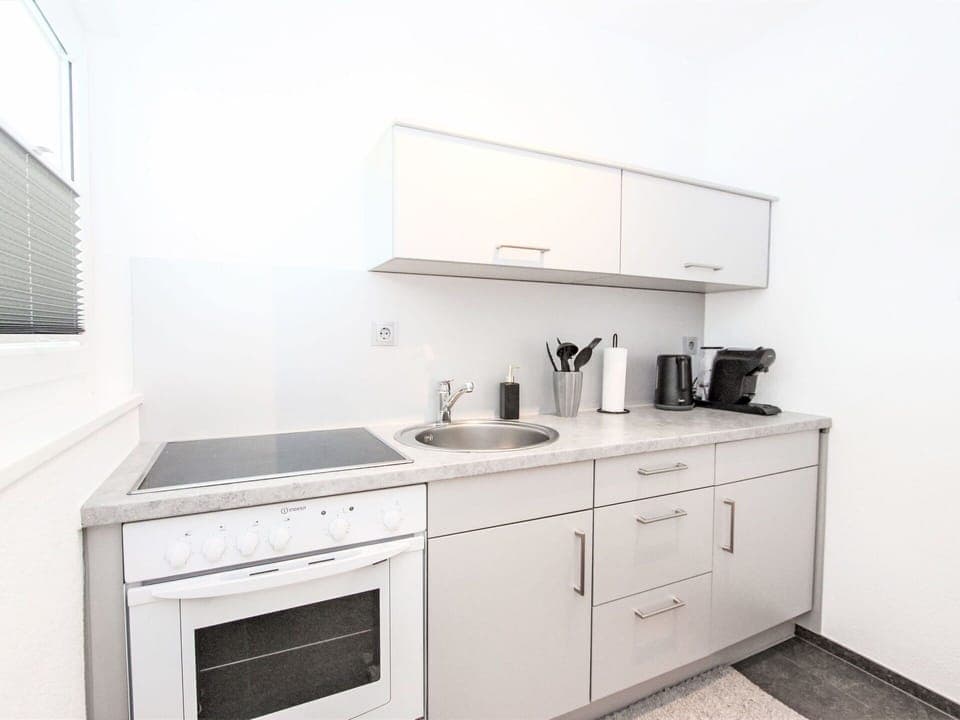 Countertop, Cabinetry, Building, Property, Furniture, Kitchen, Kitchen Appliance, Kitchen Stove, Sink, Tap