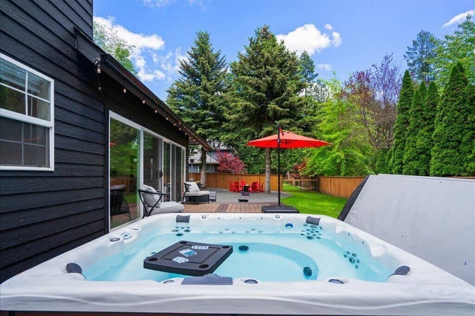 Easily step down into the 9-person hot tub from the south deck and sitting area.