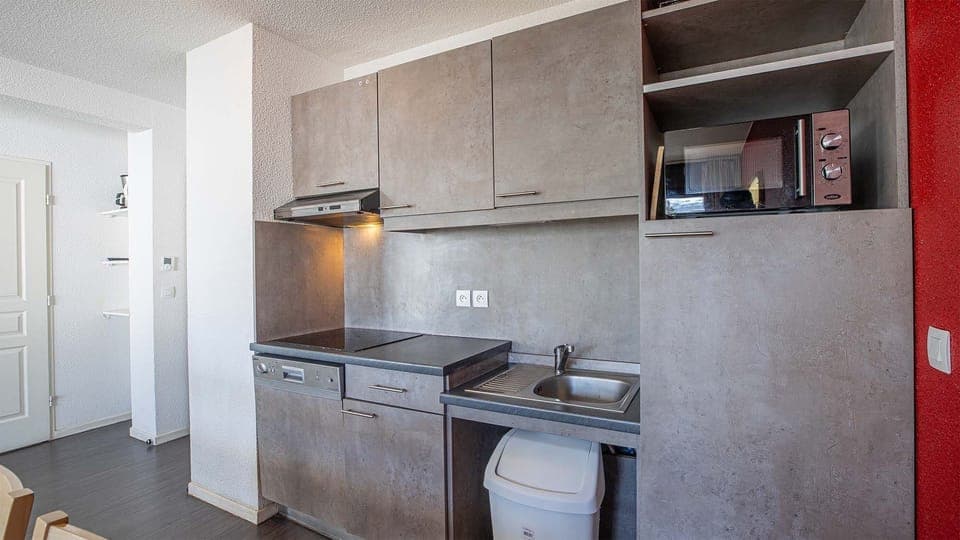 Curb your appetite by cooking a meal in your kitchenette.