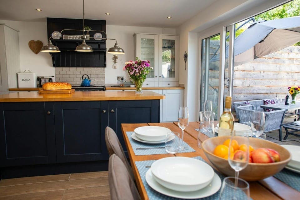 Large patio doors leading from the kitchen to the patio