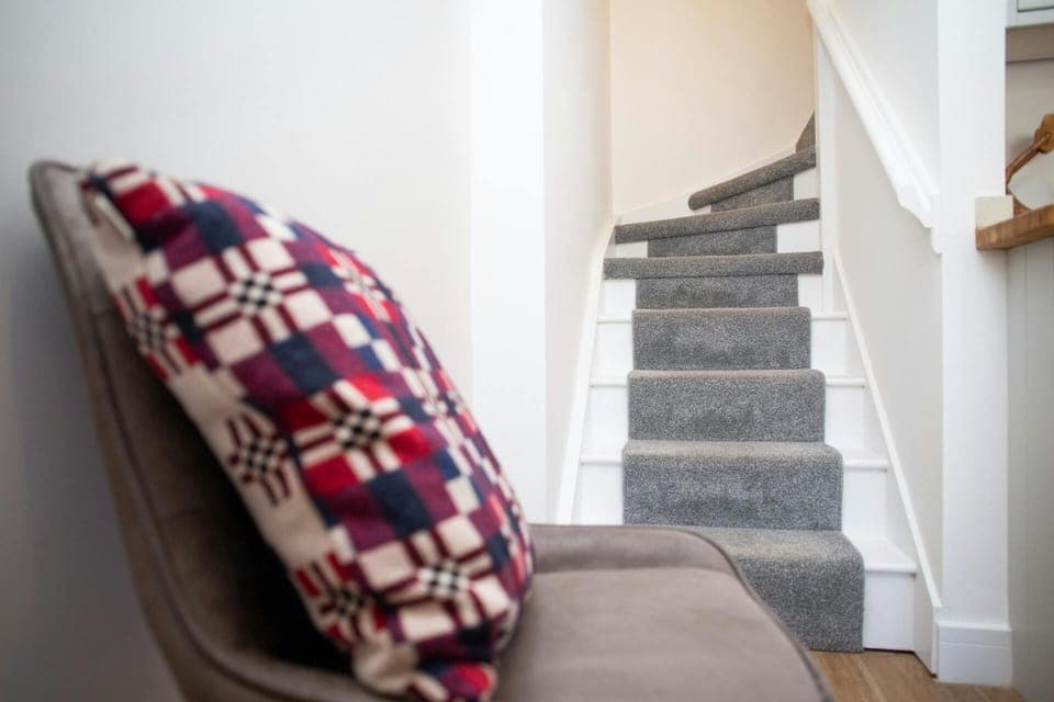 Stairs leading from the hall to the first floor