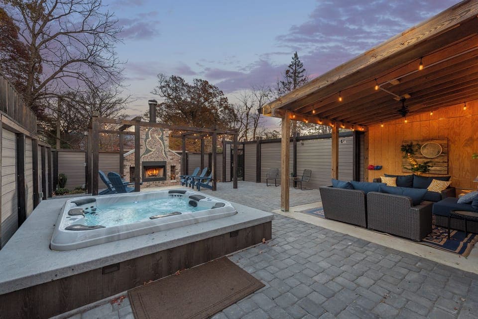 You'll love the fully enclosed courtyard with hot tub, covered lounge area, outdoor dining for 6, and custom stone fireplace with pergola and Adirondack seating at Stone Court!