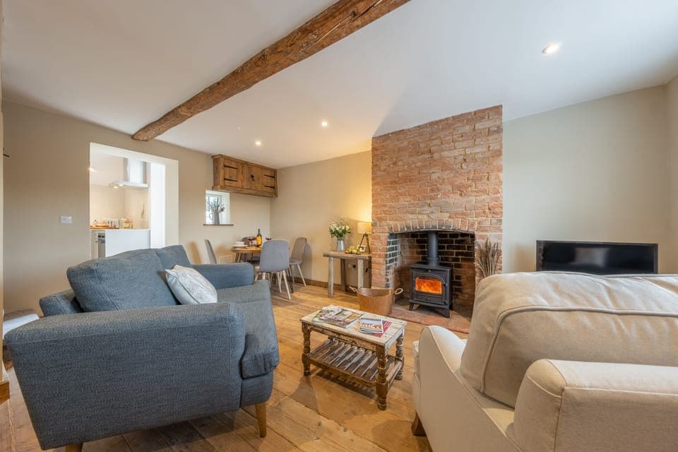 Willow Cottage, South Creake: Sitting room with wood burning stove