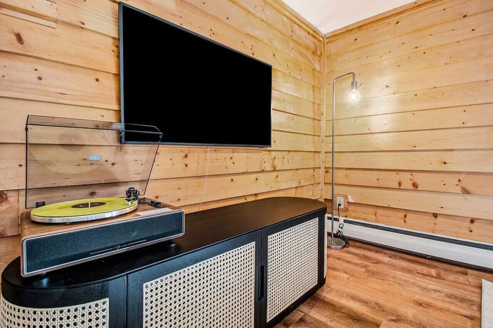 Enjoy movie nights or spin some vinyl on the turntable in the cozy media nook.