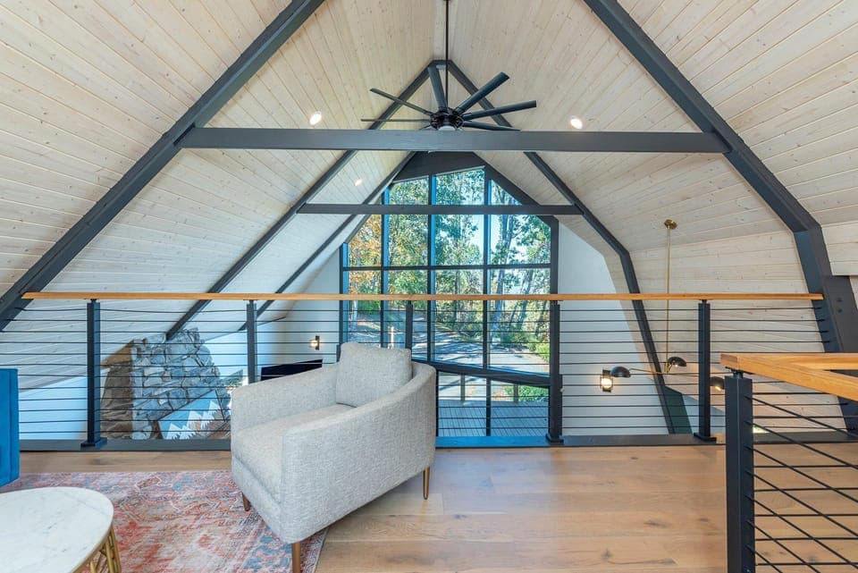 Upper-level loft with seating area.