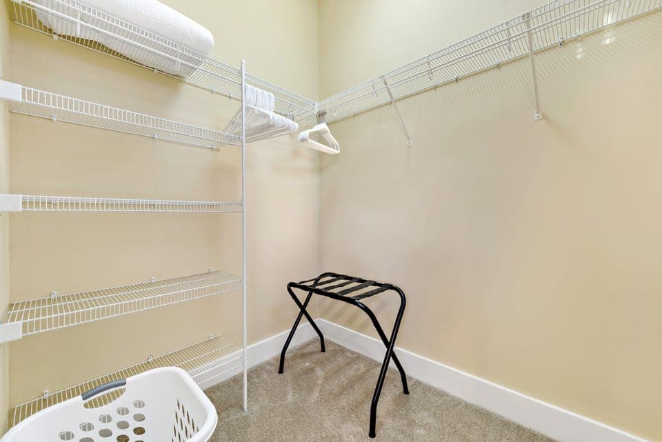 Walk-in closet in the primary bedroom.