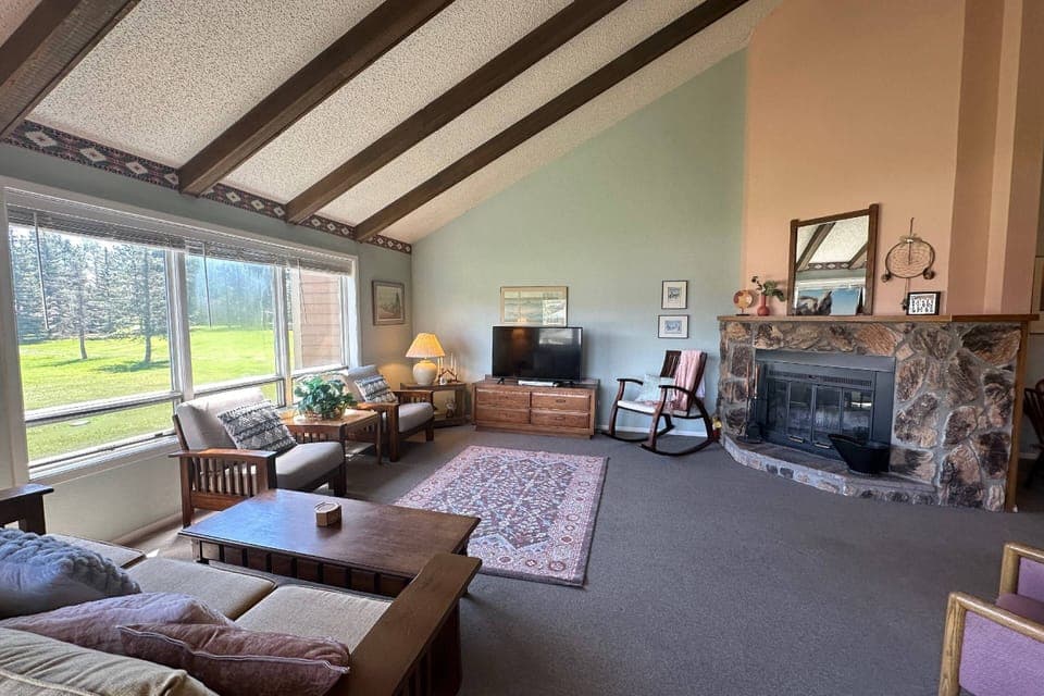 Wide open floor plan, a wood burning fireplace and great scenery