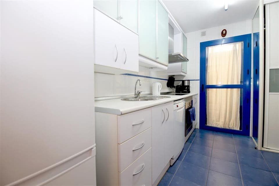Fully fitted kitchen with laundry room to the rear