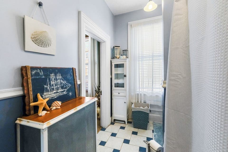 Freshen up in this bright family-friendly bathroom with soft coastal charm.