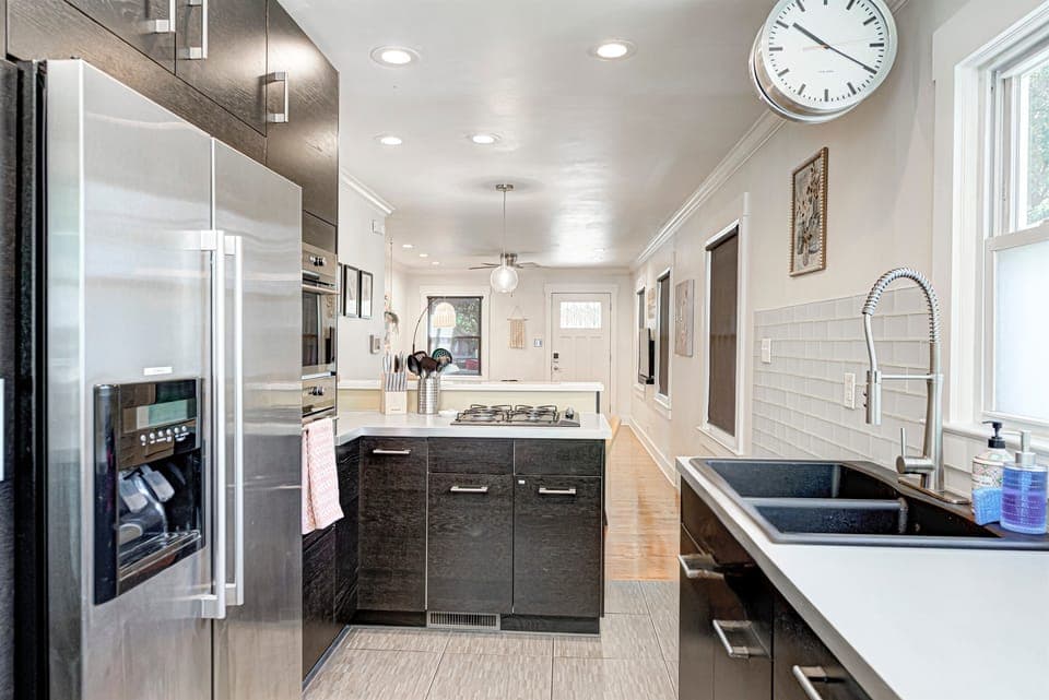 Kitchen overlooks the dining and living rooms