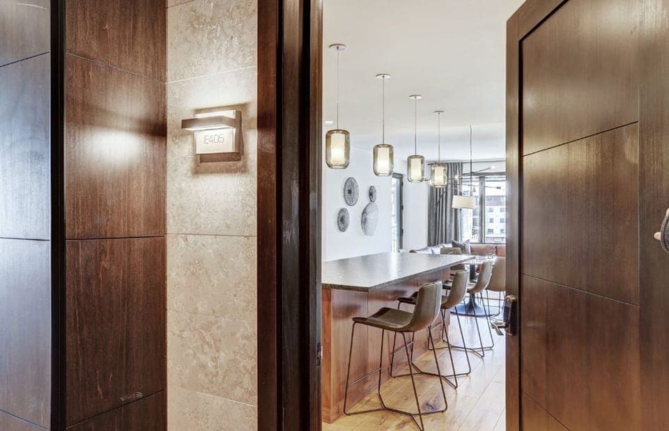 Entryway leading to an open dining and living area.