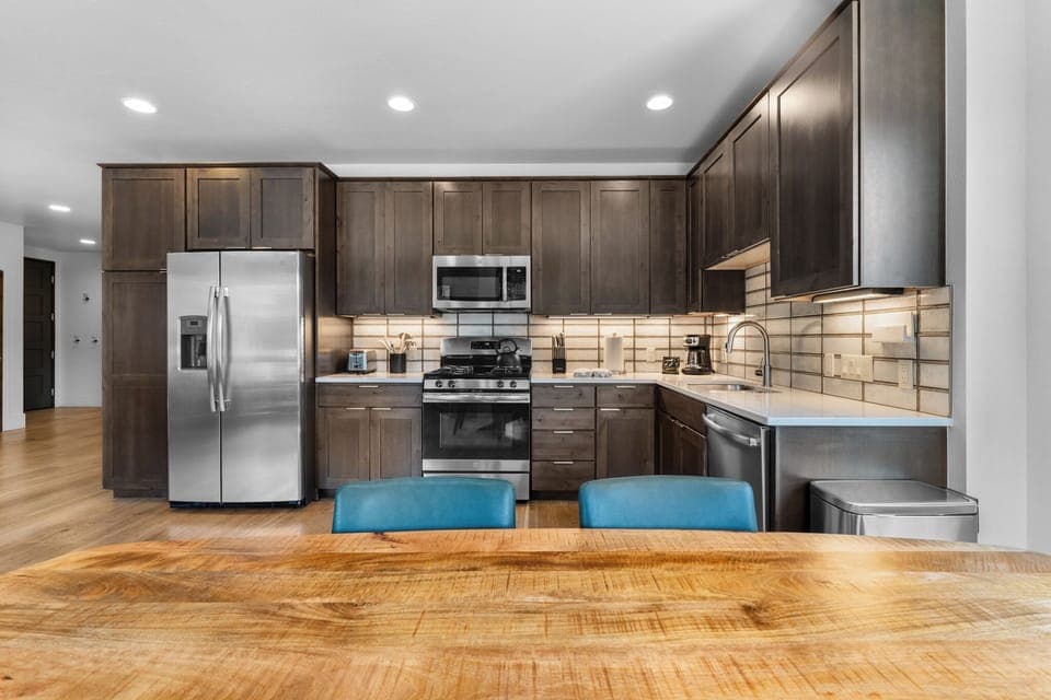 Full updated kitchen with stainless steel appliances.