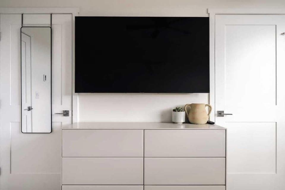 Primary bedroom with flatscreen TV