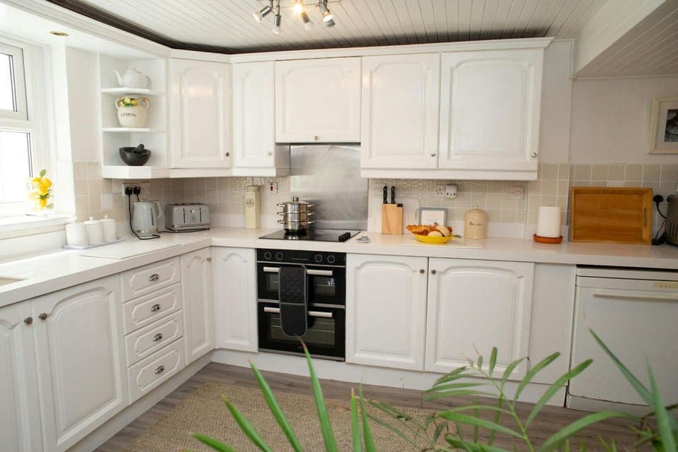 Kitchen with toaster, microwave and kettle