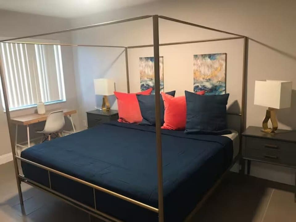 Experience the luxury of our king bed, complemented by artful paintings on the walls. Elegant side tables elevate the setting, seamlessly fusing opulence with artistic allure for a sophisticated ambiance.