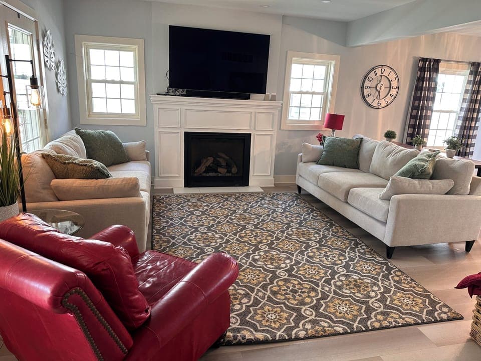 Living room with TV and gas fireplace