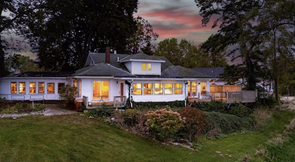 The backyard has full views of the lake, & leads down to the water. No swimming.