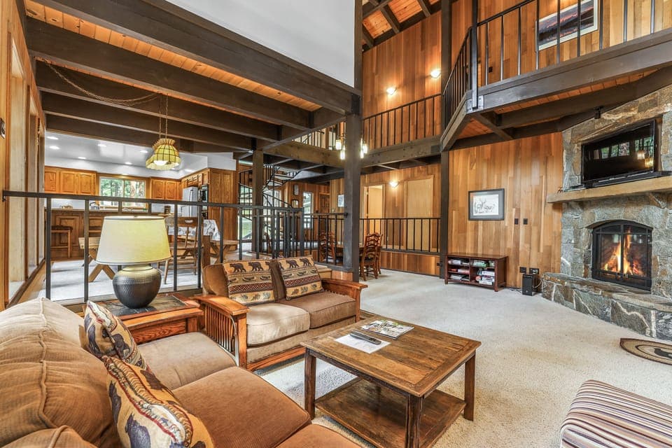 Great room with game area and circular staircase.