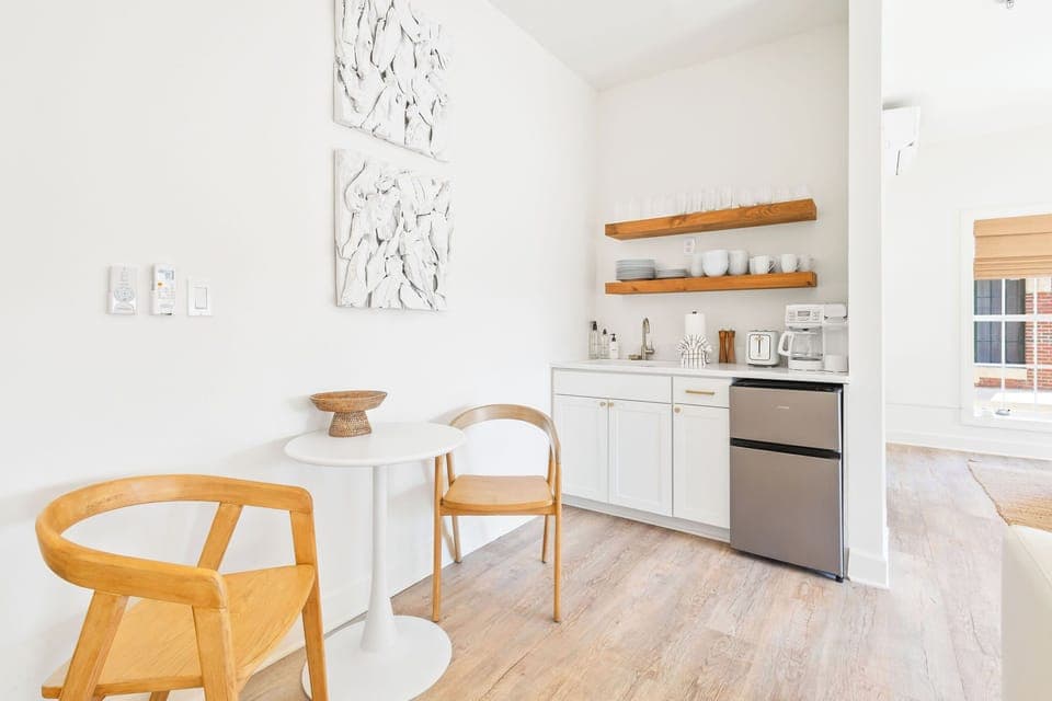 Kitchenette in condo features a toaster, Keurig/Drip coffee maker, mini fridge/freezer, and dishes!