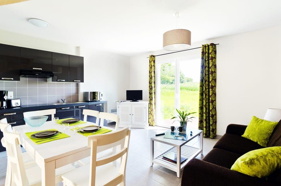 Prepare meals in the kitchenette and enjoy them at the dining table.